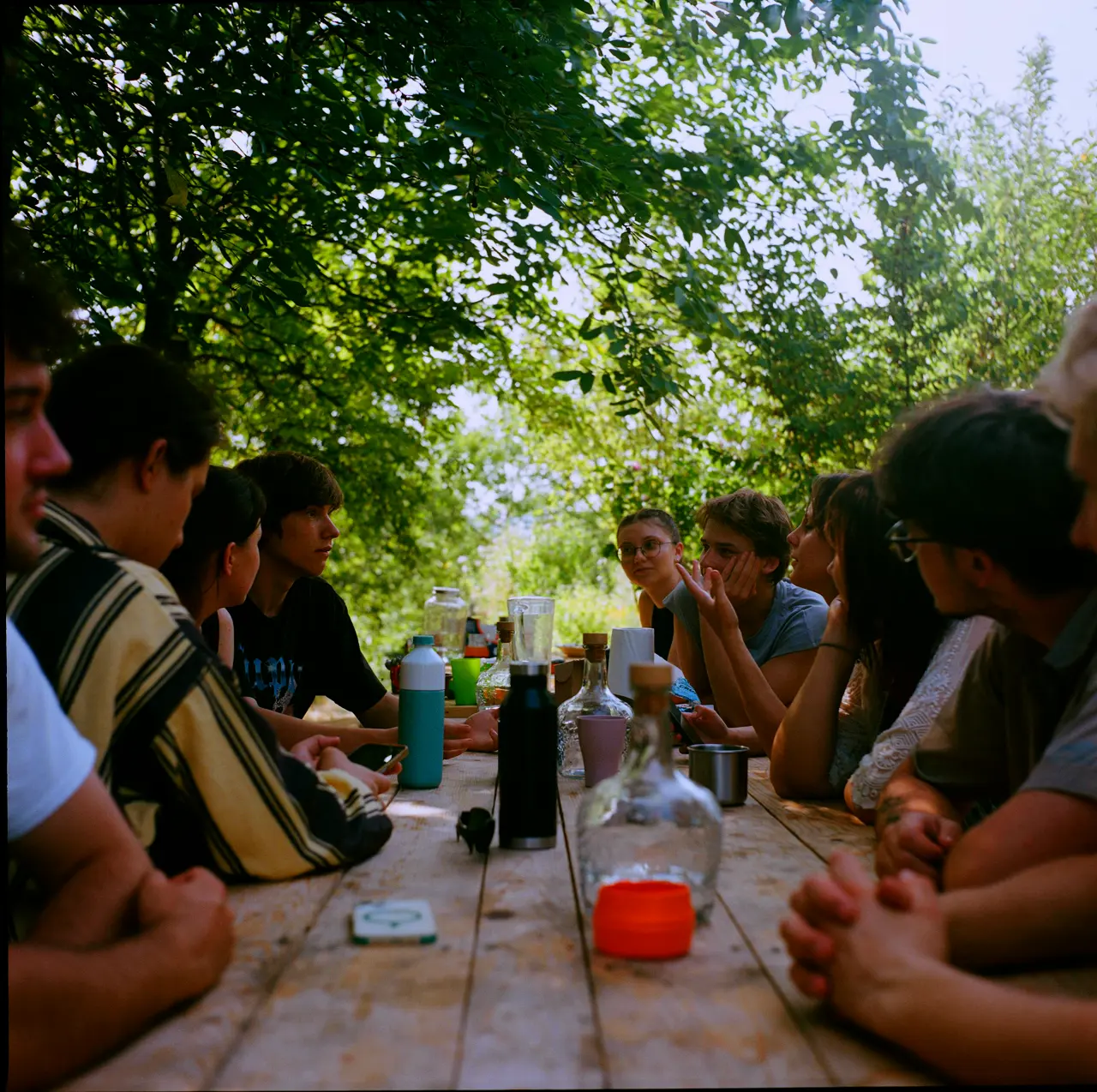 A conversation at a long table outside